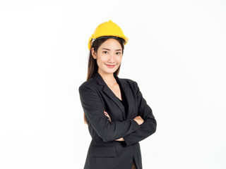 Young Asian businesswoman wearing black suit and yellow safety helmet. Portrait of female engineer looking confident.
