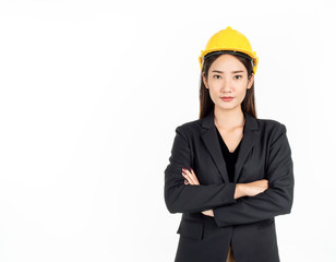 Young Asian businesswoman wearing black suit and yellow safety helmet. Portrait of female engineer looking confident.