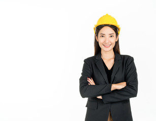 Young Asian businesswoman wearing black suit and yellow safety helmet. Portrait of female engineer looking confident.