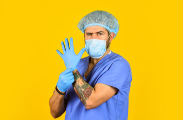 experienced doctor. doctor surgeon wear rubber glove. nurse in respirator mask. medical worker...