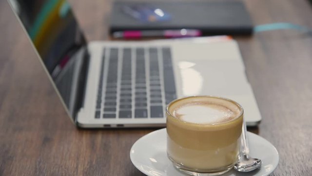 Business meeting concept at coffee cafe shop restaurant with laptop and cup of latte