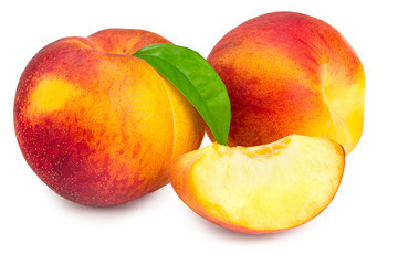 peach fruits with green leaf and slices isolated on white background