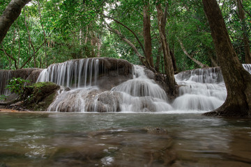 Huay Khamin waterfall with 7 levels located in Kanchanaburi in the midst of nature with green trees. Cold flowing water