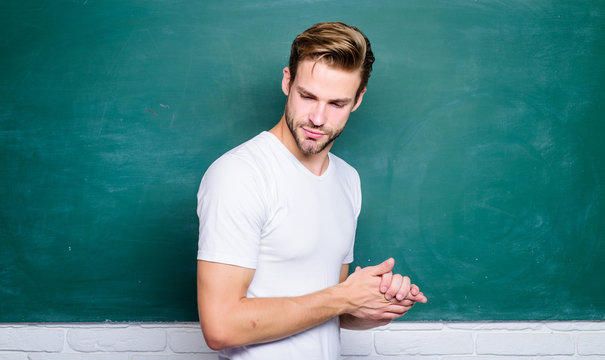 Man teacher in front of chalkboard. Teaching could be more fun. Advantages for male elementary teacher are abundant. Teacher speaker lecturer. Source of energy and inspiration. Lets begin lesson