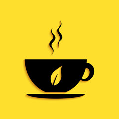 Black Cup of tea and leaf icon isolated on yellow background. Long shadow style. Vector.