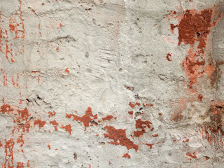 Weathered grunge white concrete wall as background.
