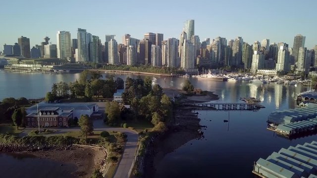The HMCS Discovery Naval Reserve On Deadman's Island Near The Royal Vancouver Yacht Club With A View Of Downtown Skyline Of Coal Harbour In Vancouver, BC, Canada.  - aerial drone