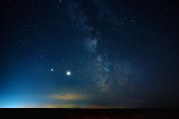 Naklejka na ściany i meble Milky way galaxy. Night sky landscape with stars