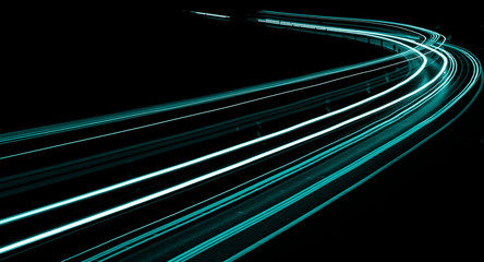 abstract aquamarine lights of cars at night
