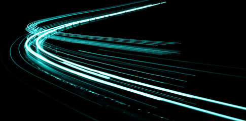abstract aquamarine lights of cars at night