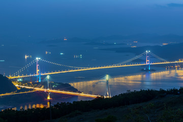 Fototapeta premium Tsing ma Bridge and Ting Kau Bridge in Hong Kong city at dusk