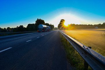 early sunrise over straight road with deminishing perspctive