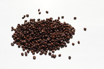 Textured background with arabica coffee beans and robusta closeup. Every day, people drink aromatic strong espresso in the morning. A popular world tradition in every country. Macro view backdrop 