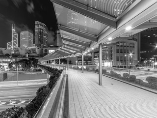 Modern pedestrian walkway in downtown of Hong Kong city at night
