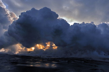 Lava flowing into the ocean from lava volcanic eruption on Big Island Hawaii, USA.