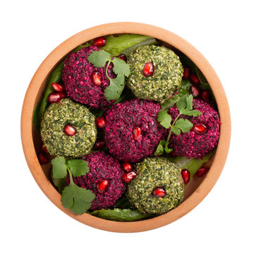Pkhali or Phali clay bowl ketsi isolated on white. Set of multicolored vegan balls from beets, spinach, ground nuts and herb. Traditional  Georgian cuisine. Top view.