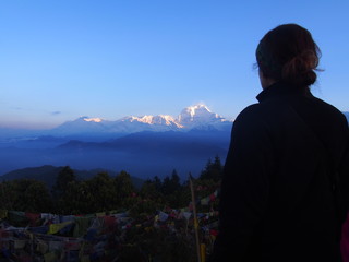 A woman looking great nature, A hill station "Poon Hill" overlooking the Annapurna Massif range and Dhaulagiri mountain range, ABC (Annapurna Base Camp) Trek, Annapurna, Nepal
