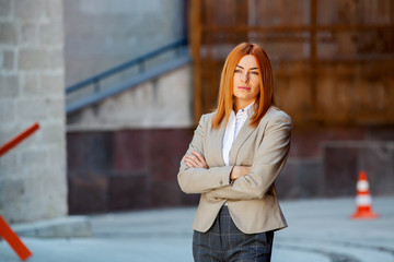 Confident business expert. Happy successful professional posing near office building. European girl. Russian business lady. Female business leader concept. Portrait Of Successful Business Woman