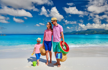 Family with three year old boy on beach. Seychelles, Mahe.
