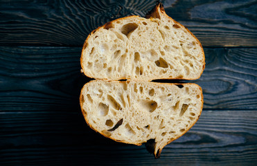 Homemade tartine bread on dark wooden table