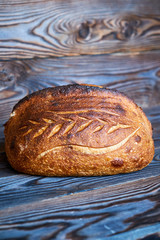 Homemade tartine bread on dark wooden table