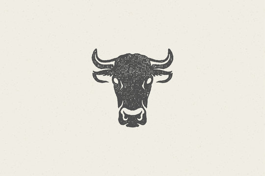 Black cow head silhouette with horns designed for meat industry hand drawn stamp effect vector illustration.