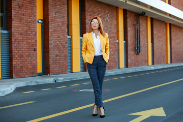 Confident business expert. Happy successful professional posing near office building. European girl. Russian business lady. Female business leader concept. Portrait Of Successful Business Woman