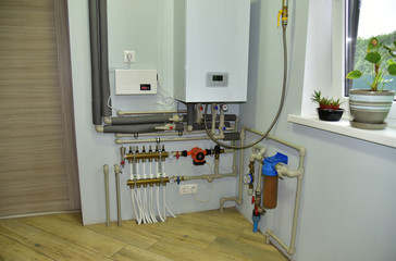 Independent heating system in boiler room at home. Domestic water supply system. Water supply for underfloor heating. Rainwater filter system. Servo, sensors and temperature control. Soft focus