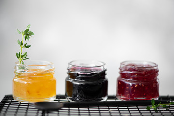 homemade berry jam in small jars