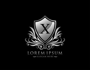 Luxury Shield X Letter Logo. Graceful Elegant Silver shield icon design.