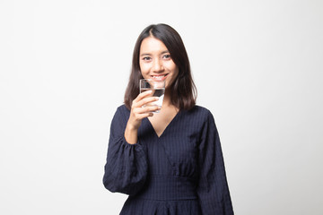 Young Asian woman with a glass of drinking water.