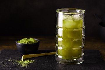 iced matcha green tea with ice in glass
