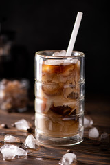 iced black coffee with milk in a glass
