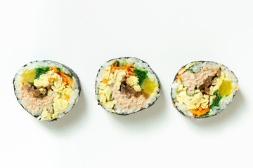 Korean gimbap rolls isolated on white background top view.
