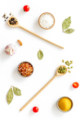 Asian and Indian spices and herbs in wooden spoons for cooking