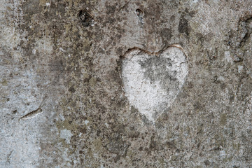 The shape of a heart on a concrete wall