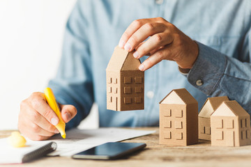 Considering buying a home, investing in real estate. Broker signs a sales agreement.