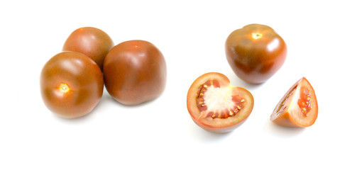 Dark red fresh tomatoes whole and slices isolated on white background.