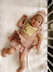 little girl lying on the bed