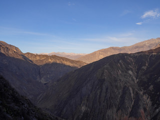 Naklejka na ściany i meble Mountain landscape during sunrise and sunset in Cañon del colca (Colca Canion) in Arequipa, Peru