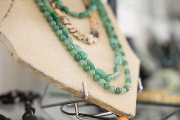 Necklace from aventurine stone in a jewelry store. High quality photo