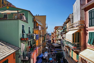 Fototapeta na wymiar Walking people in the main street in Manarola small town, Cinque Terre