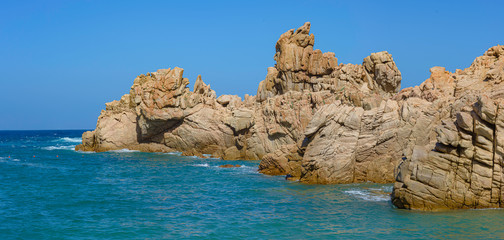 Fototapeta na wymiar Beautiful shot of rock formations near the sea close to Beach Li Cossi, Sardinia, Italy.