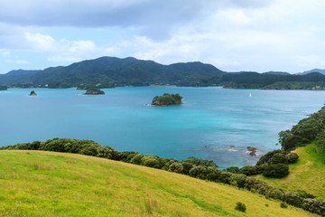 Bay of Islands, New Zealand. The view from the rolling hills of Urupukapuka Island, looking back towards the mainland