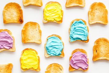 Set of slices toast bread with butter and cheese spread. Top view