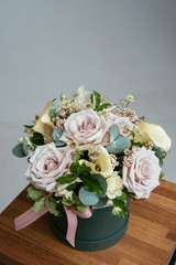 Bouquet of flowers in green hat box