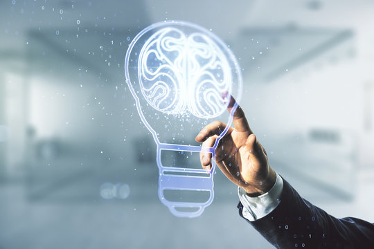 Man hand clicks on abstract virtual creative light bulb with human brain hologram on blurred office background, artificial Intelligence and neural networks concept. Multiexposure - Powered by Adobe