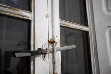 knife closing white wooden window