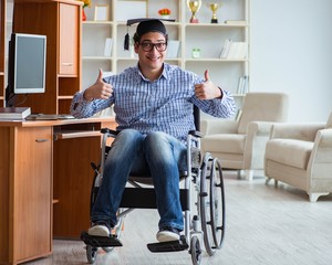 Disabled student studying at home on wheelchair