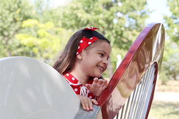 Little girl in red dress Mickey Mouse